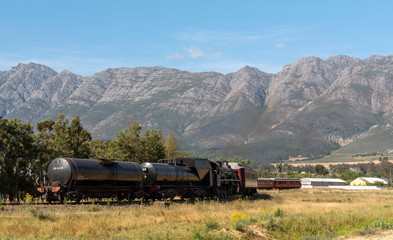 Wolseley, Swartland region, South Africa. Dec 2019. Steam train, diesel powered crossing a rural...