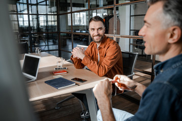 Business english education training for company employees. Developing English communication skills with clients. Successful business strategy plan concept. Confident office worker indoor in coworking