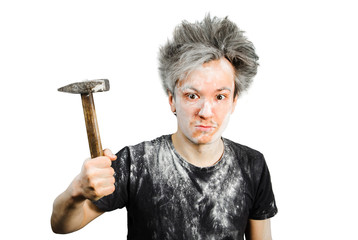 Dirty young builder guy freak in plaster is hold a hammer on isolated background at home during...