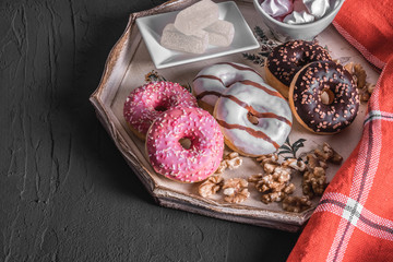marmalade and sweet donuts lie on a white plate