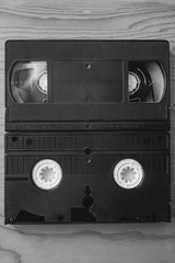 Stack of VHS video tapes as background. Old video cassette tapes. Retro technology.	