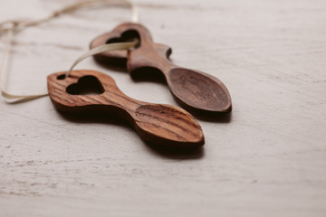 Traditional welsh wooden spoon in white background. Wooden love spoon from Wales.	