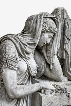 Woman crying in the cemetery. An image of suffering