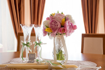 Wedding rings, cups and flowers