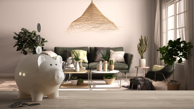 Wooden table top or shelf with white piggy bank with coins, vintage, old style living room with sofa, expensive home interior design, renovation restructuring concept architecture