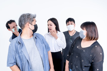 People of Asian wearing a mask To prevent germs, looking at women Who was coughing and sneezing with displeasure On white background, to health care and basic virus protection.