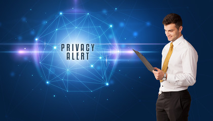 Businessman thinking about security solutions with PRIVACY ALERT inscription