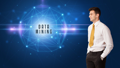 Businessman thinking about security solutions with DATA MINING inscription