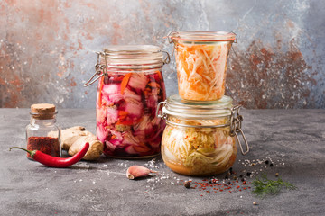 Fermented cabbage, fermented vegetables, kimchi in glas jars, marinated canned food, natural probiotics, healthy eating - 323498694
