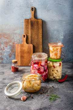Fermented cabbage, fermented vegetables, kimchi, sauerkraut in glas jars, marinated canned food, natural probiotics, healthy eating, prebiotic rich food for digestion
