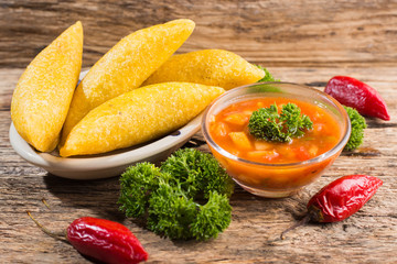 Empanadas with hot sauce, traditional Colombian food