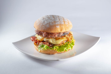 burger with handmade bread on white background