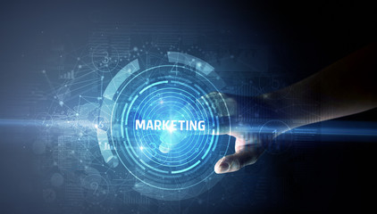 Obraz premium Hand touching MARKETING button, modern business technology concept