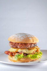 burger with handmade bread on white background