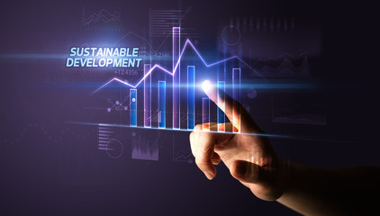 Hand touching SUSTAINABLE DEVELOPMENT button, business concept