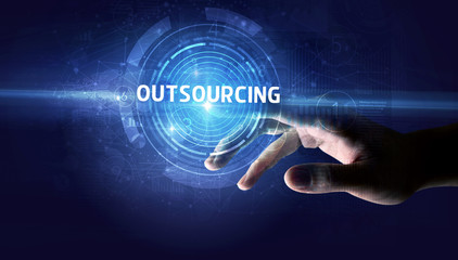 Hand touching OUTSOURCING button, modern business technology concept