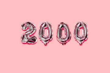 Air helium silver 2000 balloons on a pink background. Congratulation followers concept. Holiday...