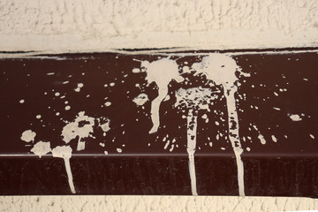 Fototapeta premium White spots from paint on a peak of a building.