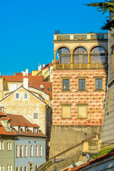 Obraz premium Top view to red roofs and blue sky skyline of Prague city Czech republic.