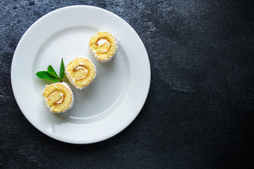 coconut sponge cake roll biscuit (delicious sweet dessert) menu concept. background. top view. copy space