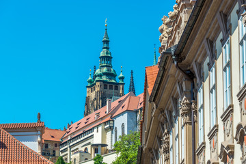 Fototapeta na wymiar View of the top of old buildings with red roof and blue sky at Prague city Czech republic.