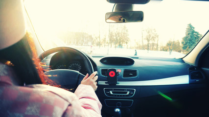 Girl driving the car.