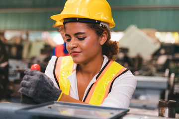 Industrial factory maintenance engineers woman inspect relay protection system of machinery with...