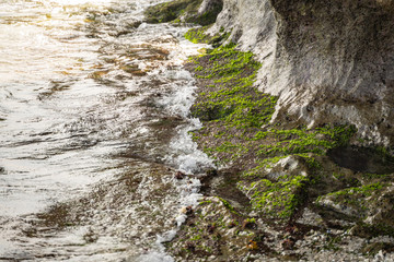 Waves coming to rocky shore stock photo