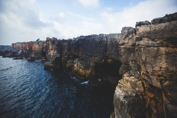 Beautiful aerial vibrant view of Boca Do Inferno (Hell's Mouth), Cascais, District of Lisbon, Portugal, shot from drone