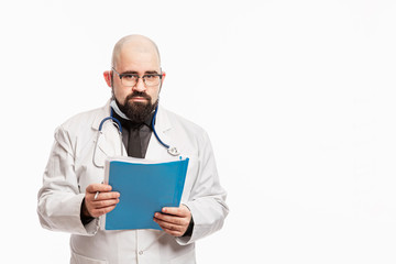 Male doctor in a white coat with a stethoscope and documents in his hands. White background. Space for text.