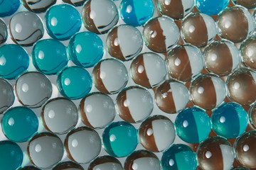 Soft focus gel balls. Macro of green transparent hydrogel background. Abstract wallpaper of bright...