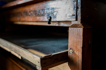 Antique old wooden egg incubator with wire screen