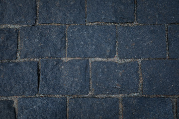 Dark grey stone road texture.
