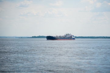 Cargo ship moving along the river