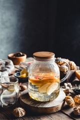 Hot tea with slices of fresh grapefruit on wooden tablet. Healthy drink, Eco, vegan