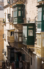 Famous colorful wooden balconies in narrow streets of Malta, Valleta. Architectural Maltese feature of of the island
