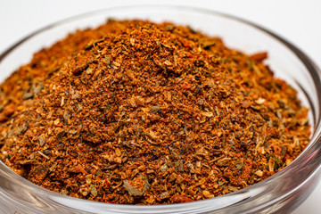 Spices for meat in a glass plate.
