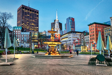 Fountain at Boston Common public park and people at night