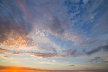Obraz premium Dramatic sunset sky with orange clouds.