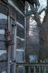 old lantern by cabin door