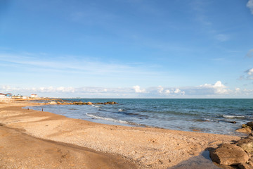 Sandy beach with seashells on sea island at low tide