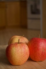Apples on a wooden cutting board