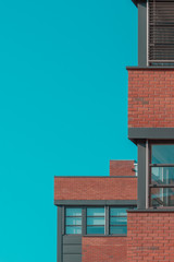 Red brick wall with windows.