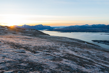 A photograph of the surrounding mountains around Tromso during sunset