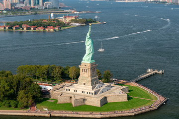 Aerial photograph of the Statue of Liberty taken during the summer with Ellis Island in the background © Phil