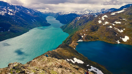 Classic view from the Besseggen ridge in Norway during a summer hike while camping outdoors.