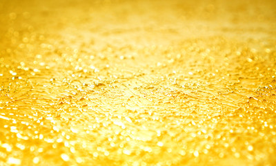 Blurred golden background made with decorative enamel with effect of chromium