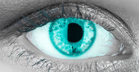 Closeup of green, coral human eye. Macro pupil retina human colse eye, eyeball. Female eyes with...
