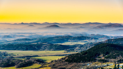 Hilly landscape on sunny and foggy day. Weather inversion. Central Bohemian Highlands, Czech: Ceske...