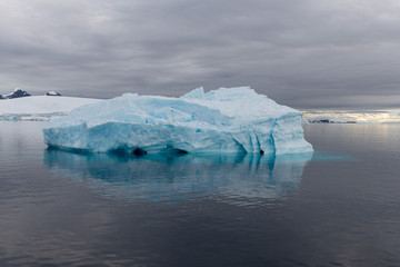 Antarctic landscape with iceberg, view from expedition ship